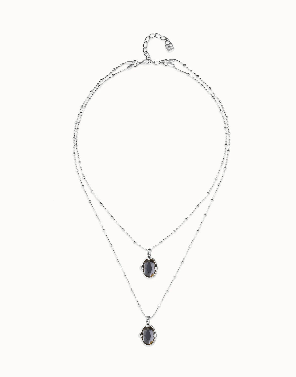 Collar COL2030NGRMTL doble bañado en plata con dos cristales facetados ovalados negros
